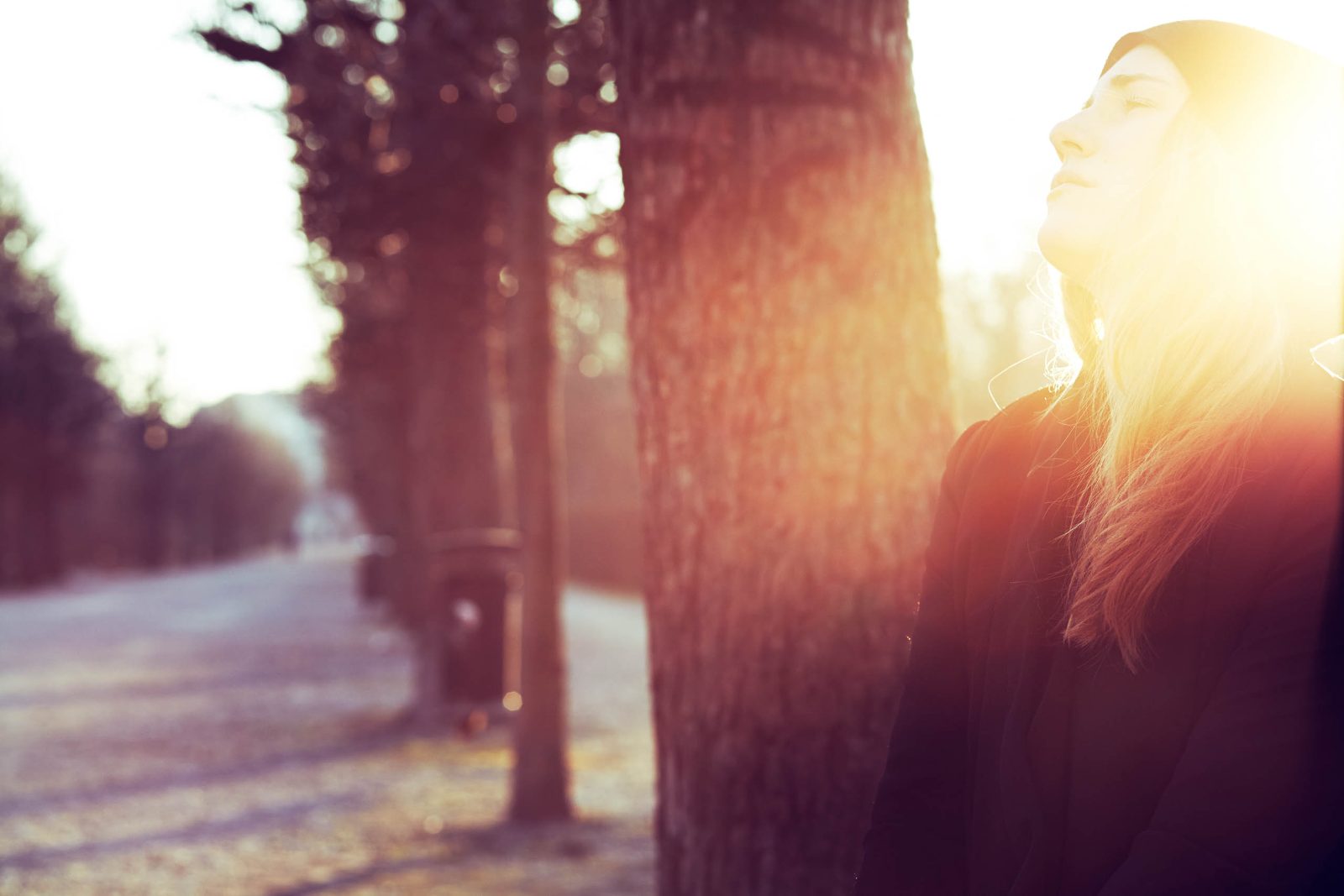 Woman in winter light, backlit