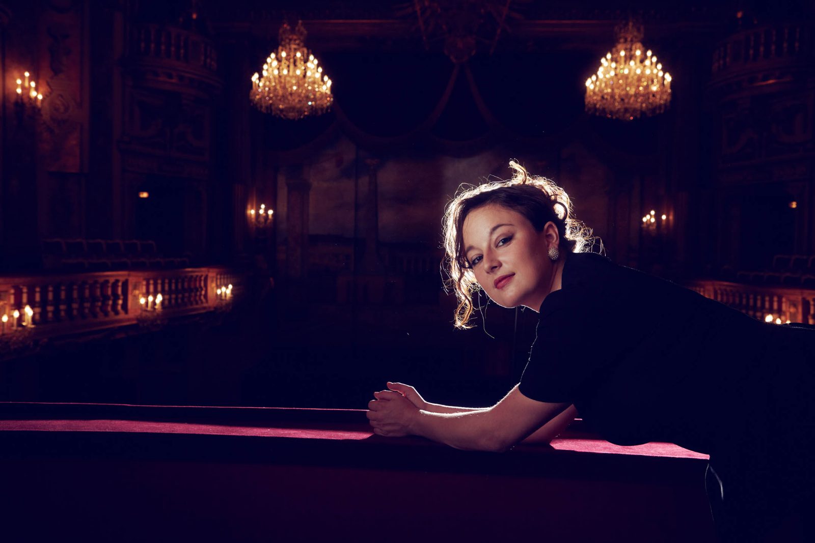 Portrait in a candlelit theatre